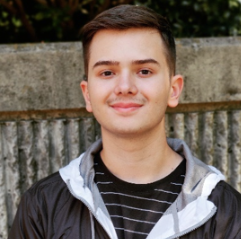 Alex smiles