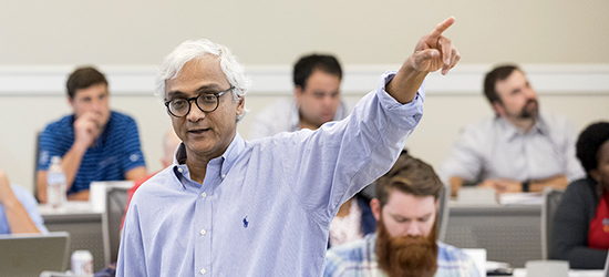 Professor pointing to his left