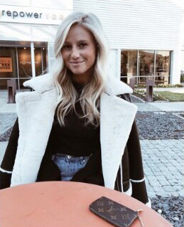 Rachel sits at a table