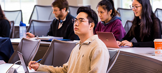 A male student looks up during a lecture