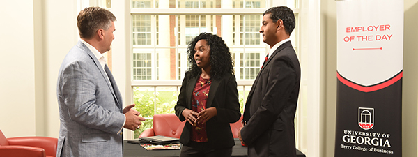 An employer talks to two prospective hires at Terry