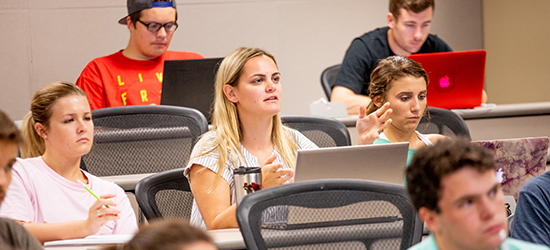 A female student responds to a question