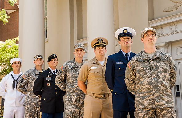 United States military members lined up in the branch's uniform.