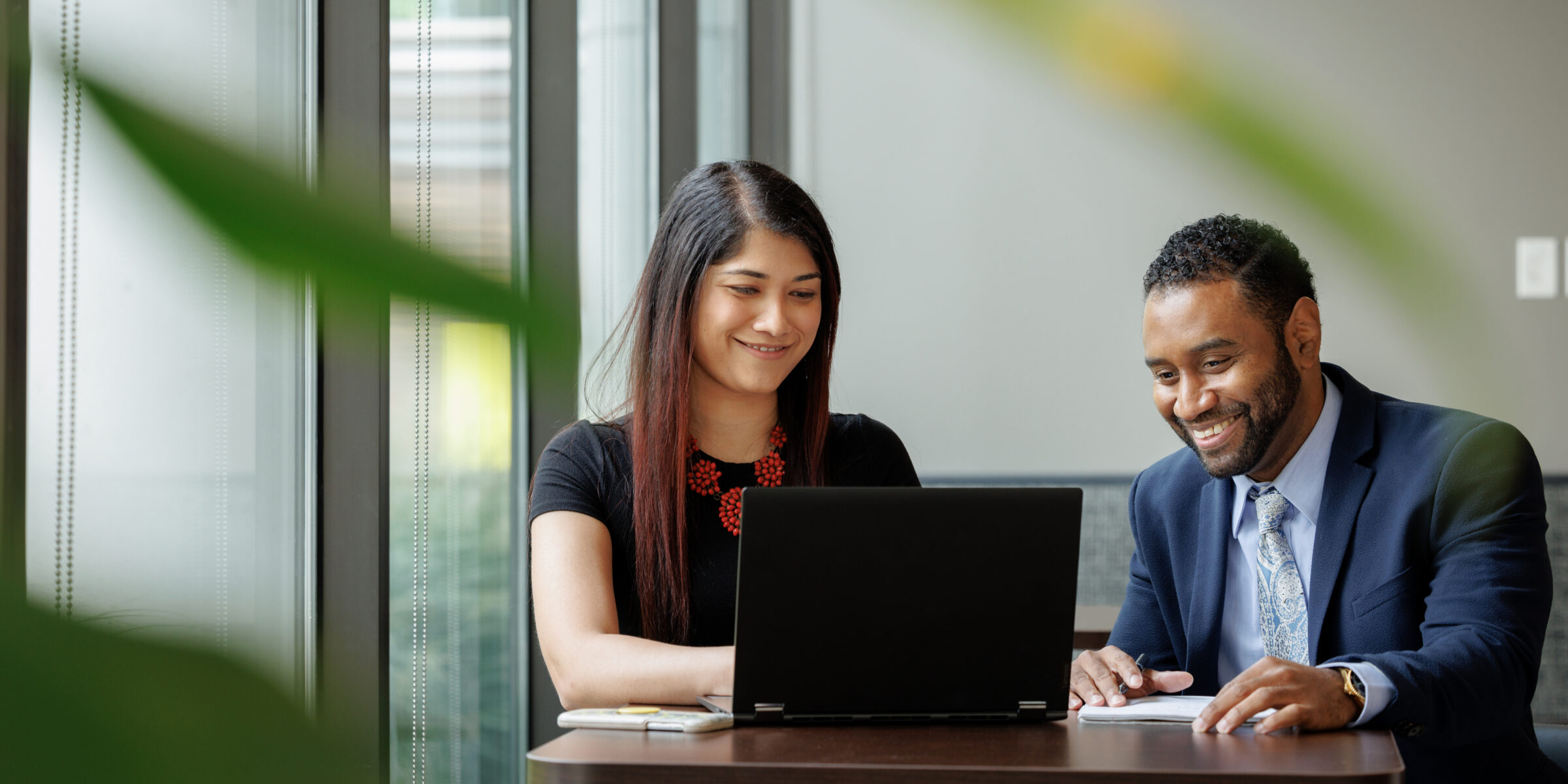 Two professionals collaborating at a table.