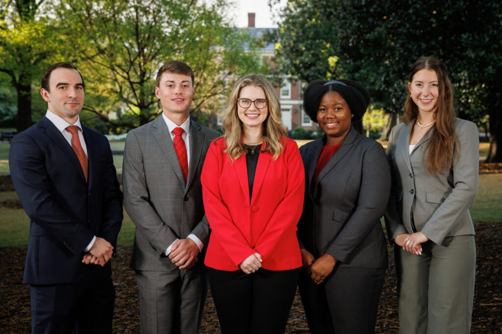 Nominees for Terry College of the year including from left Grant McDonald, Tyler Ege, Morgan Pope, Eniola Olubunmi and Gabriella Lewis, posed on UGA's North campus in businesswear