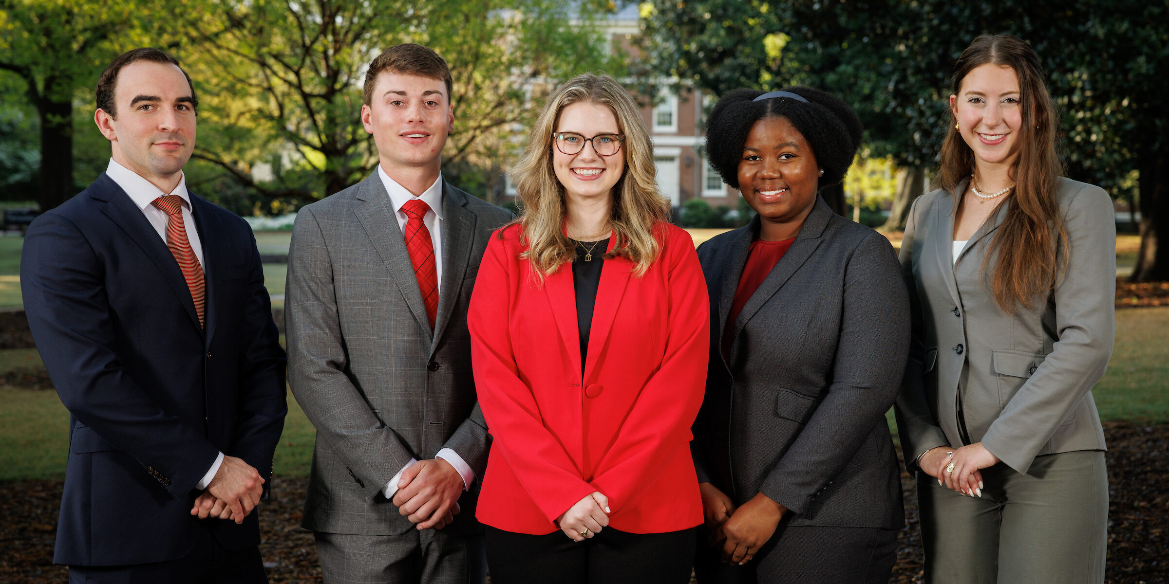 Nominees for Terry College of the year including from left Grant McDonald, Tyler Ege, Morgan Pope, Eniola Olubunmi and Gabriella Lewis, posed on UGA's North campus in businesswear