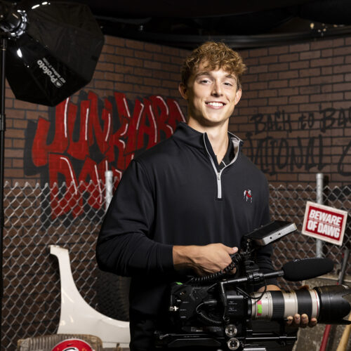 UGA Football Creative student videographer Trent Nesbit poses for a portrait for the Game Changers Campaign in the Football Creative studio.
