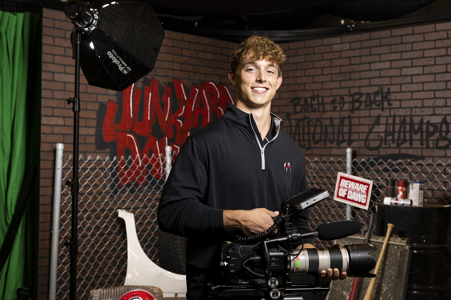 UGA Football Creative student videographer Trent Nesbit poses for a portrait for the Game Changers Campaign in the Football Creative studio.