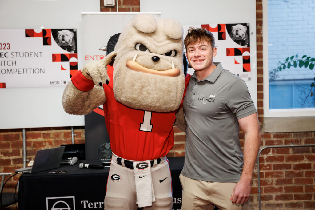 Hairy Dawg makes the number 1 sign while side-hugging Matt Tesvich at Studio 225