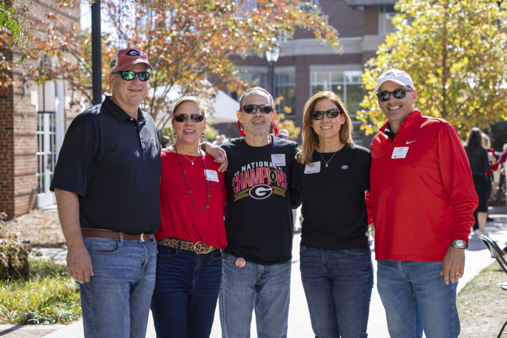 Group of people outside smiling for camera
