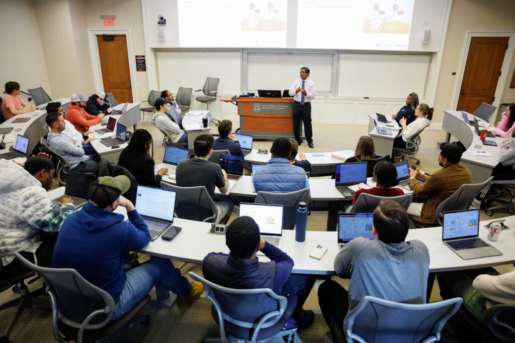 Santanu Chatterjee teaches a MBA course in a large classroom at the UGA Terry College of Business.