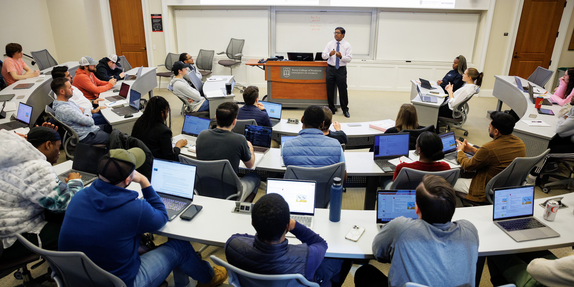 Santanu Chatterjee teaches a MBA course in a large classroom at the UGA Terry College of Business.