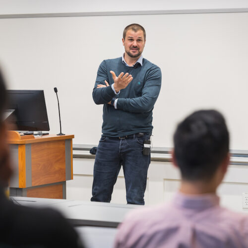 Visiting international scholar Jan Recker speaks with faculty and graduate students at the Terry Department of Management Information Systems
