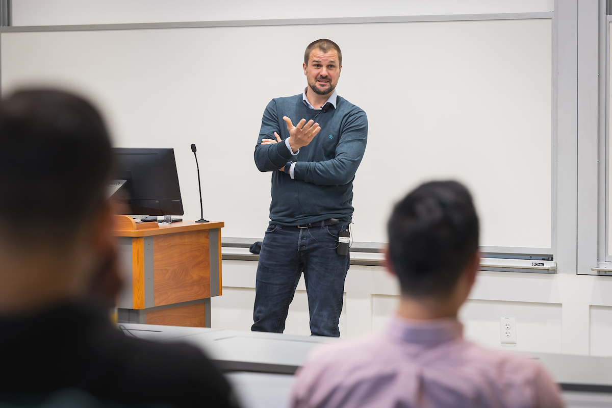 Visiting international scholar Jan Recker speaks with faculty and graduate students at the Terry Department of Management Information Systems