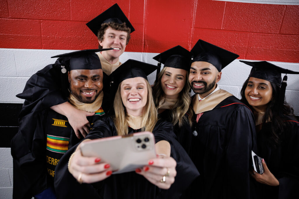 graduates take selfie