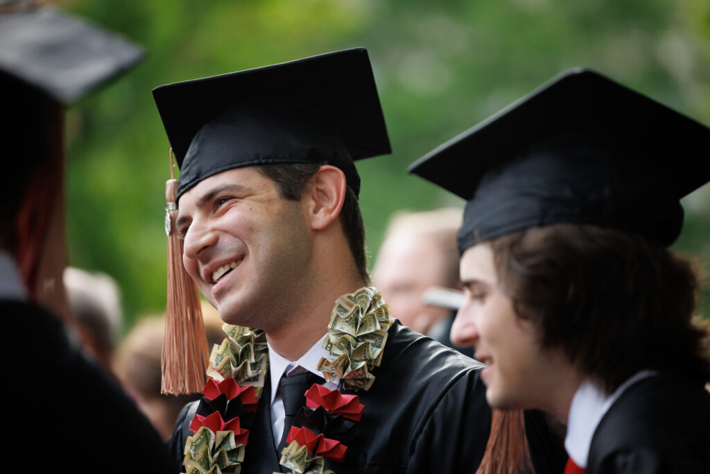 graduate wearing money lei