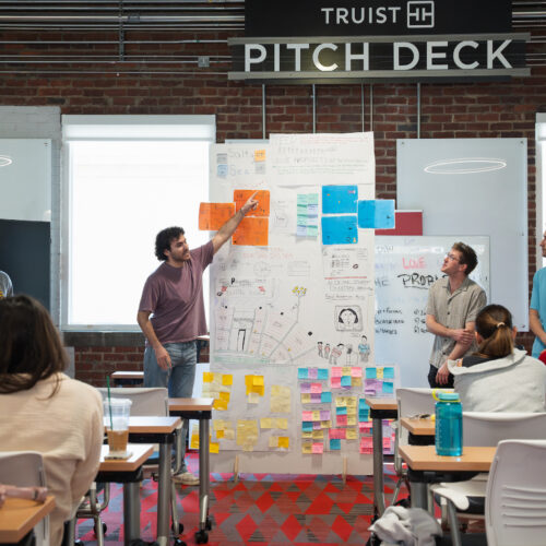Students present in front an Entrepreneurship Class in UGA's Studio 225. New UGA Entrepreneurship faculty