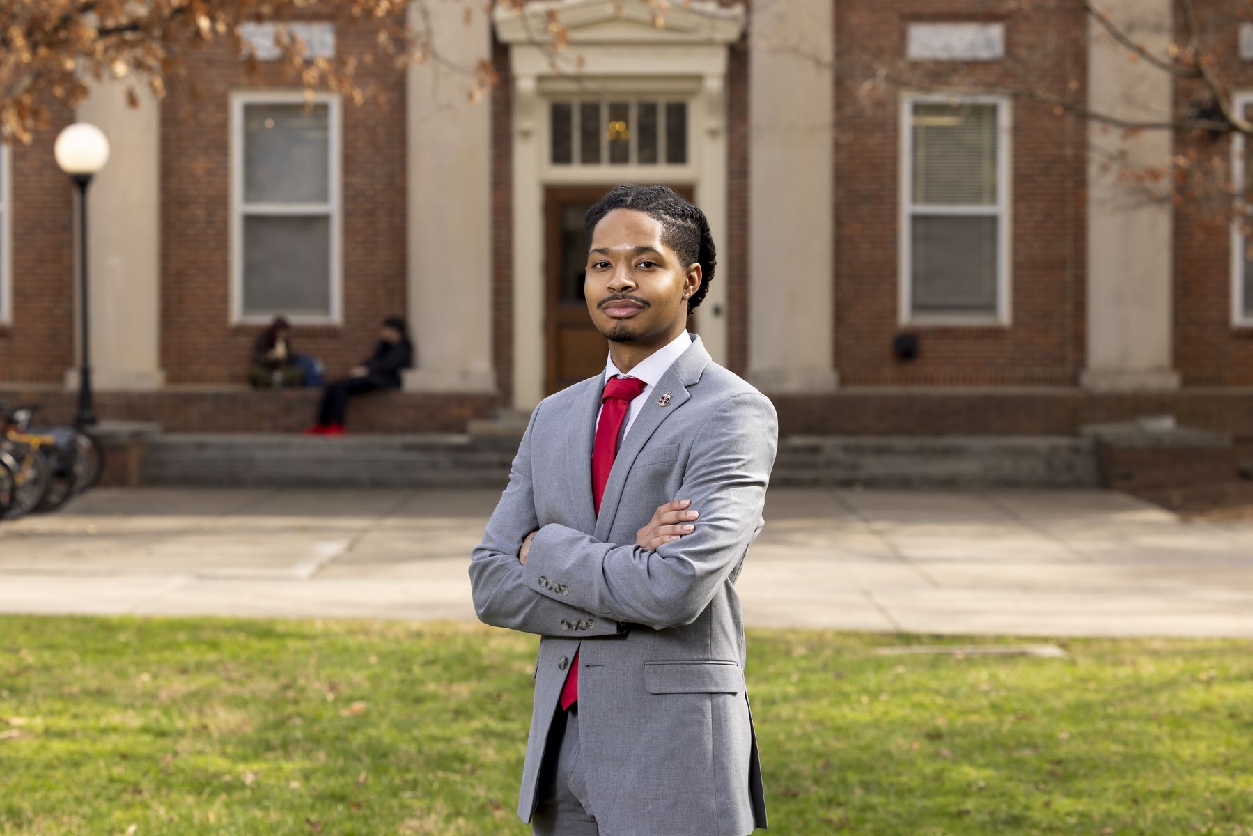 Corey Straughter Jr stands in front of a historic building on UGA's North Campus