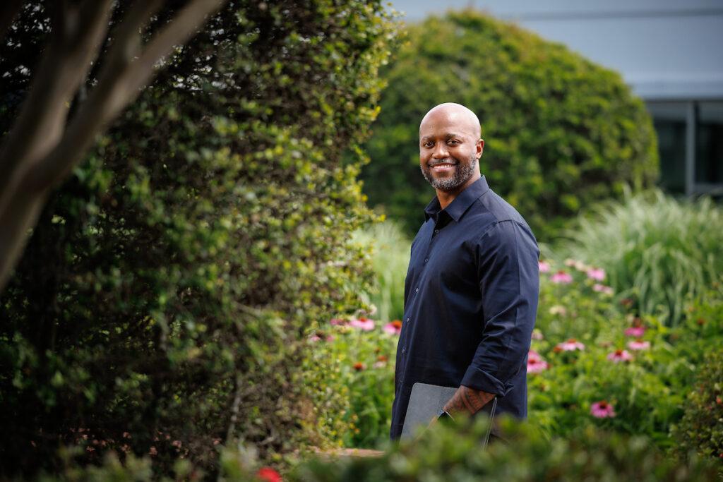 20250508_bp_bridges_003 Portrait of a man with lush foliage in the background