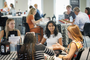 Students chatting at a table