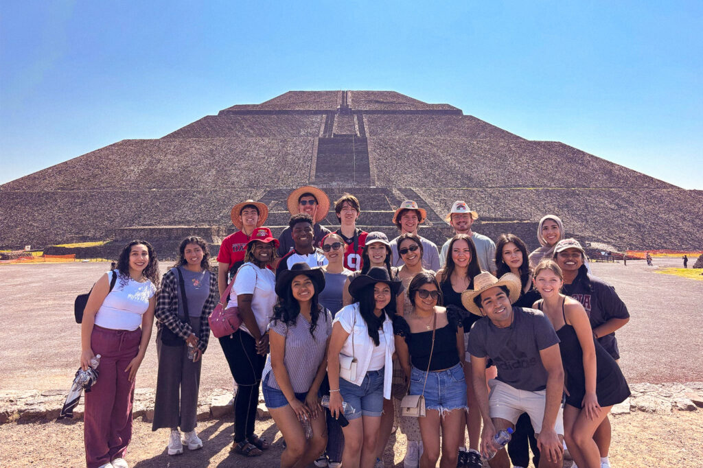 Students pose in front of an Teotihuacan pyramid outside of Mexico City.