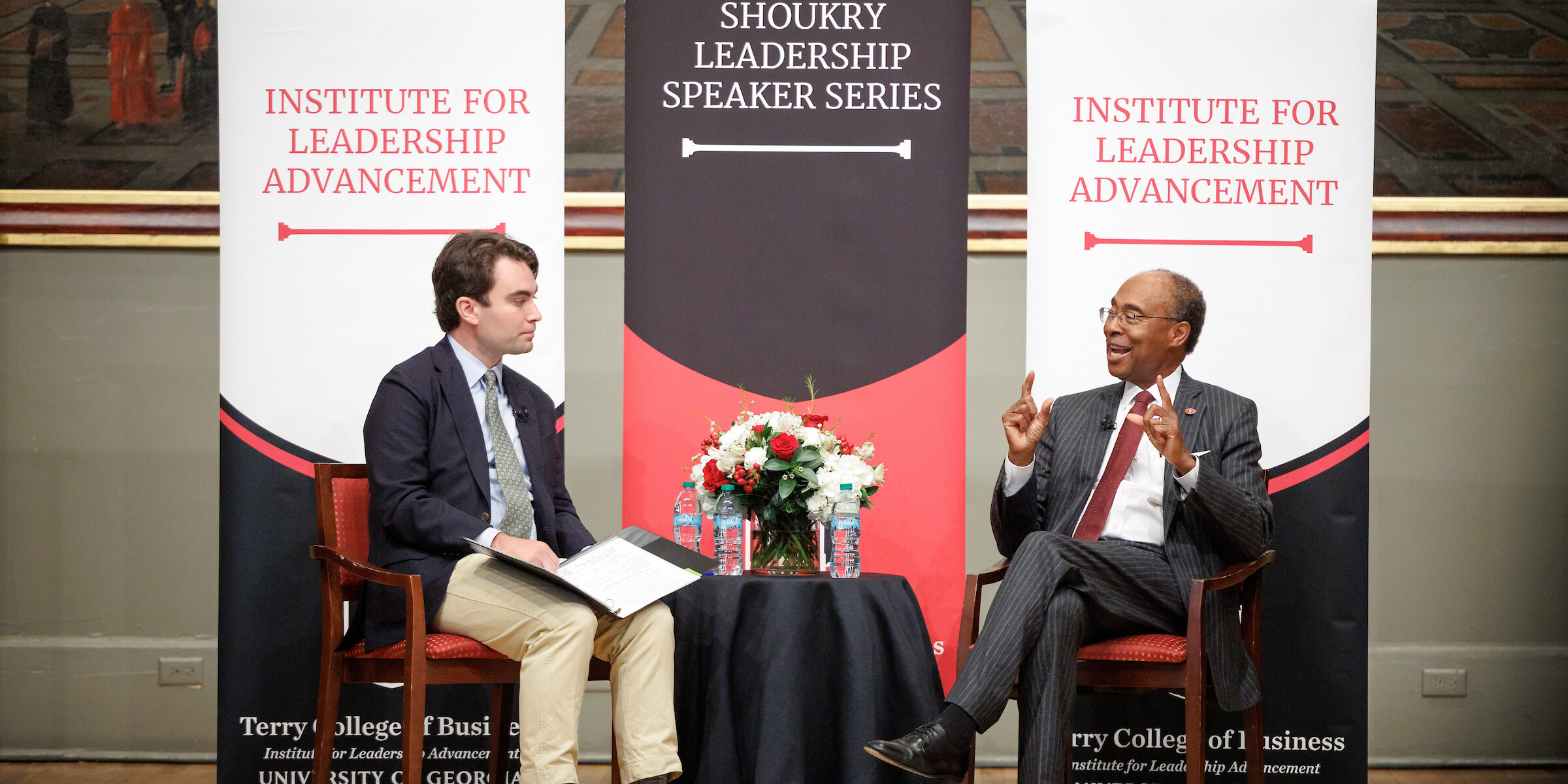 Brandon Cox, an ILA alumnus, interviews Federal Judge Steve Jones on stage at the UGA Chapel.