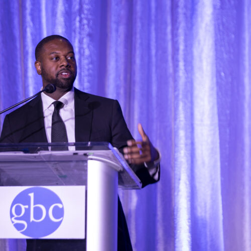 Mark Anthony Thomas speaks at a Greater Baltimore Committee podium.