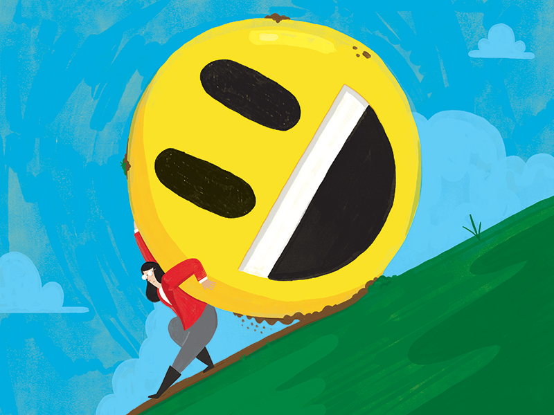 A woman pushing a giant smiley emoji up a hill like Sisyphus