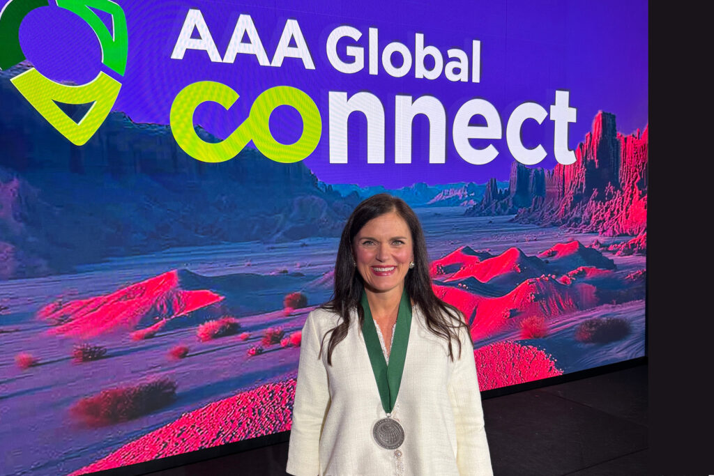 Tina Carpenter in front of AAA Global Connect