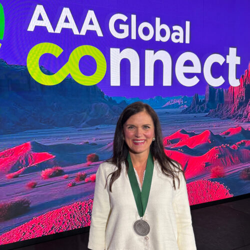 Tina Carpenter in front of AAA Global Connect