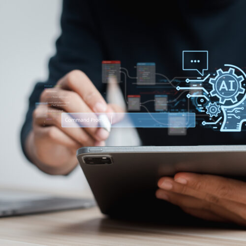 photo illustration of a person holding a stylus and a tablet computers with a blue digital-looking AI