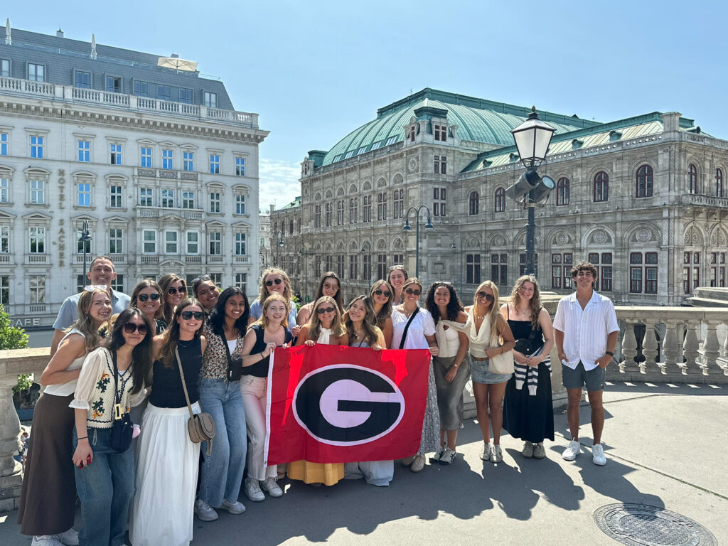 international business study abroad program students stand in front of the state opera house in Vienna, Austria
