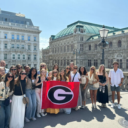 international business study abroad program students stand in front of the state opera house in Vienna, Austria