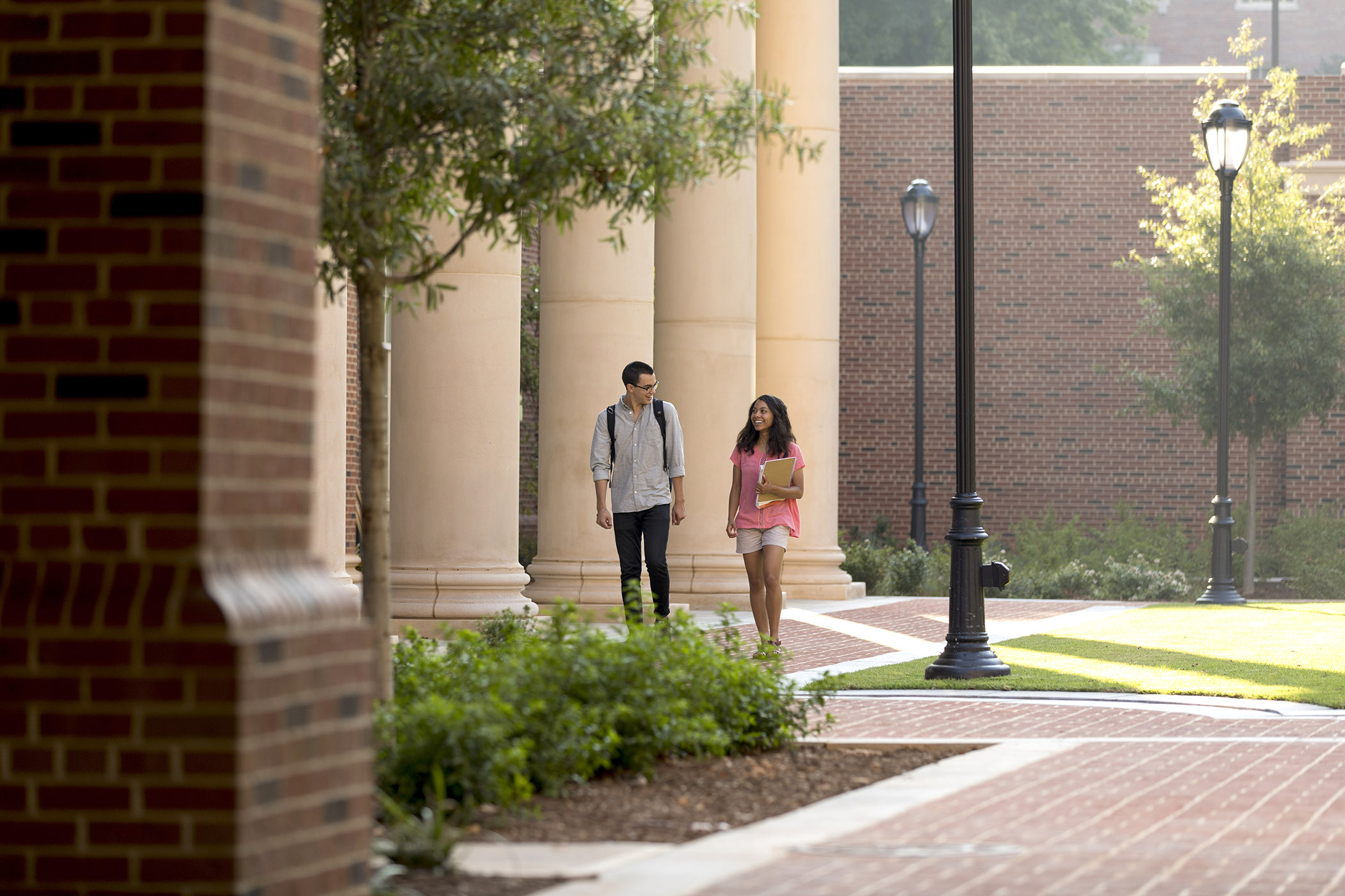 Two students walk to class in the Business Learning Community.