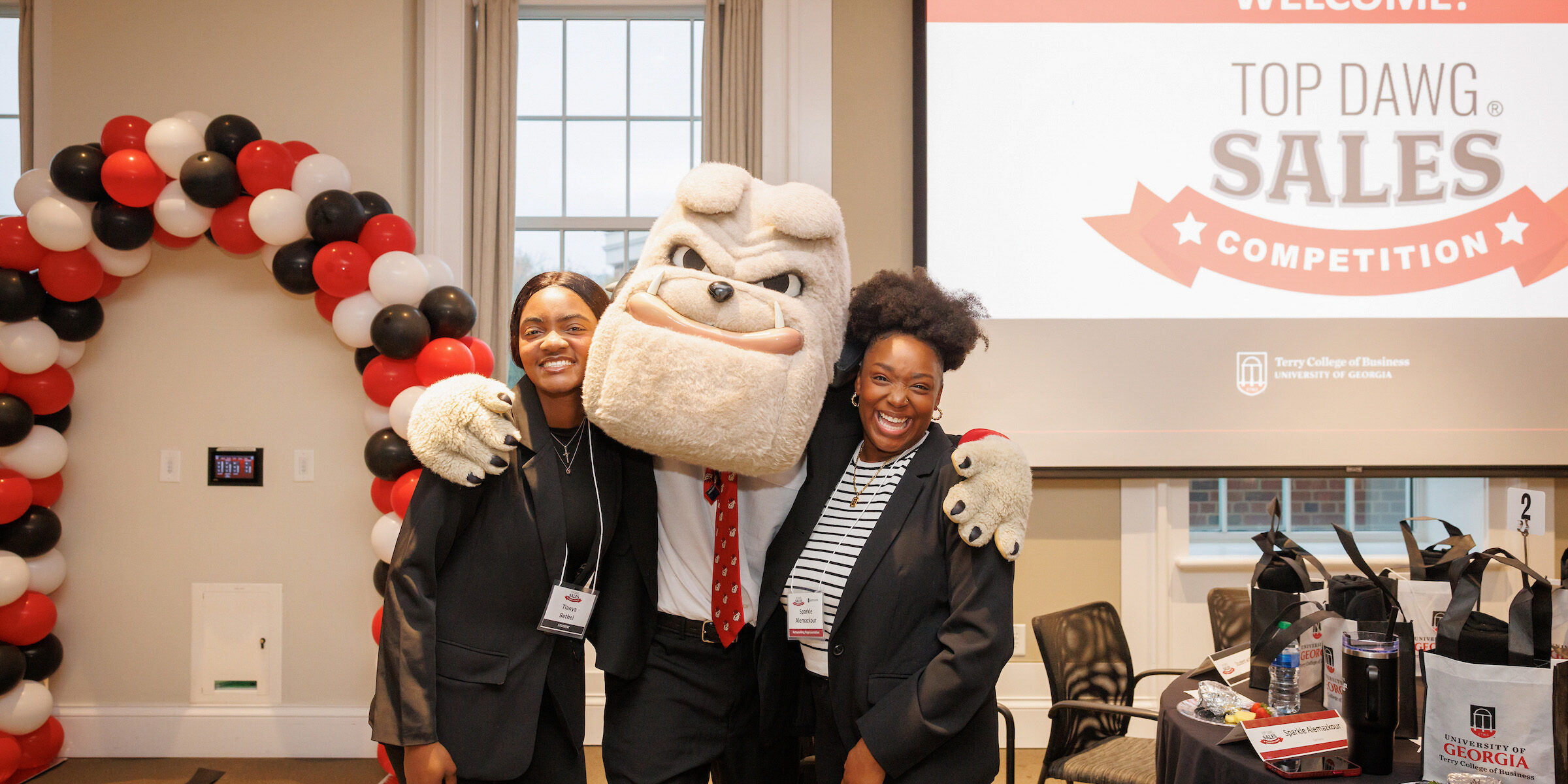 UGA Terry College sales students pose with Hairy Dawg mascot at Big Dawg Sales Competition.