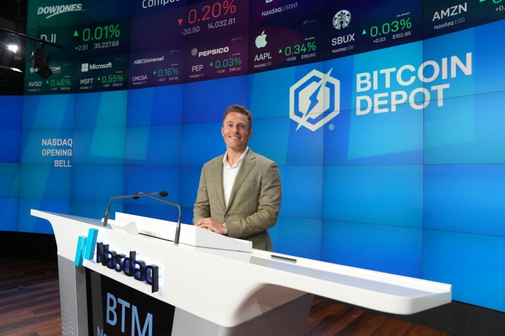 Brandon Mintz in the NASDAQ studio after ringing the bell to open the studio.