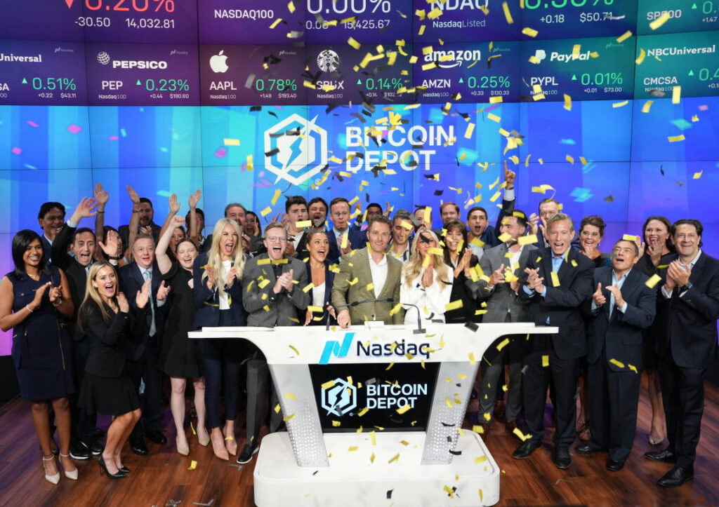 Brandon Mintz's family and the staff of Bitcoin Depot celebrate after ringing the bell at the NASDAQ.
