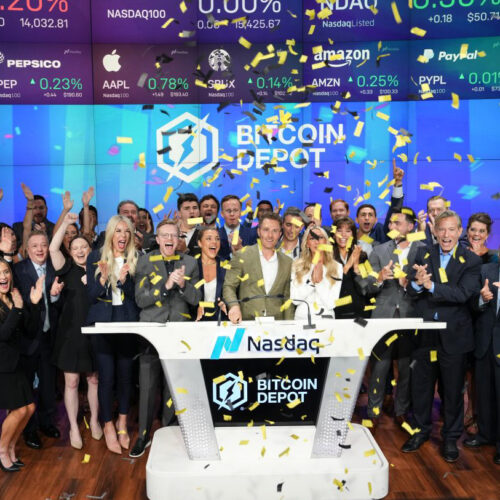 Brandon Mintz's family and the staff of Bitcoin Depot celebrate after ringing the bell at the NASDAQ.
