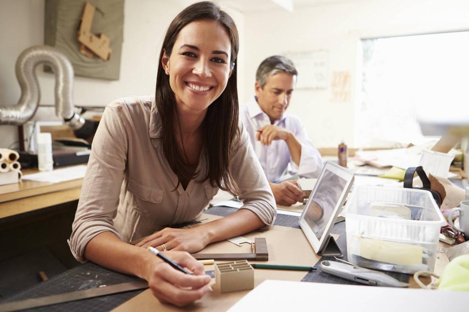 Woman in workshop smiling