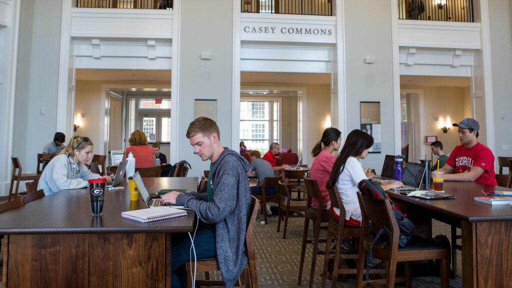 Students study in the Casey Commons at the Business Learning Community.