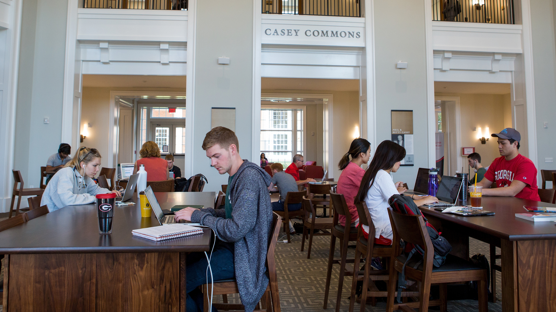 Students study in the Casey Commons at the Business Learning Community.