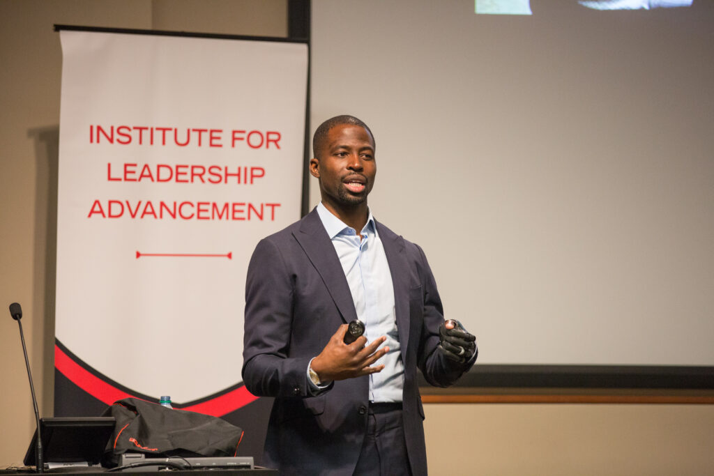 Former UGA football player Mohamed Massaquoi shares his story with Terry students at a Diversity and Inclusion Lecture Series event.