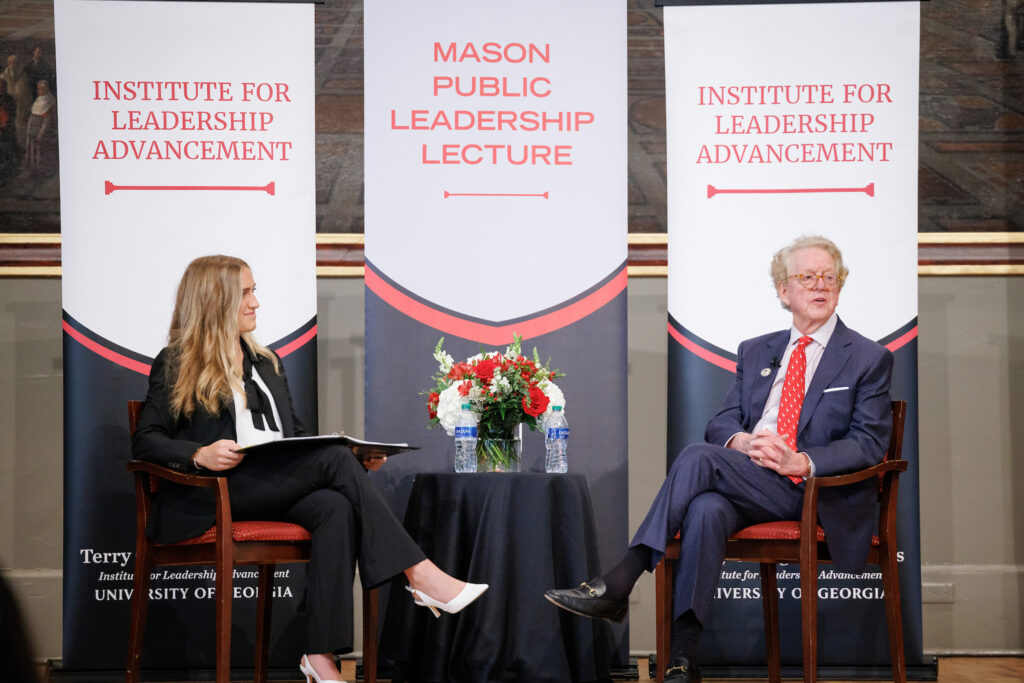ILA Student EB Billings interviews Aflac CEO Dan Amos on stage at the UGA Chapel