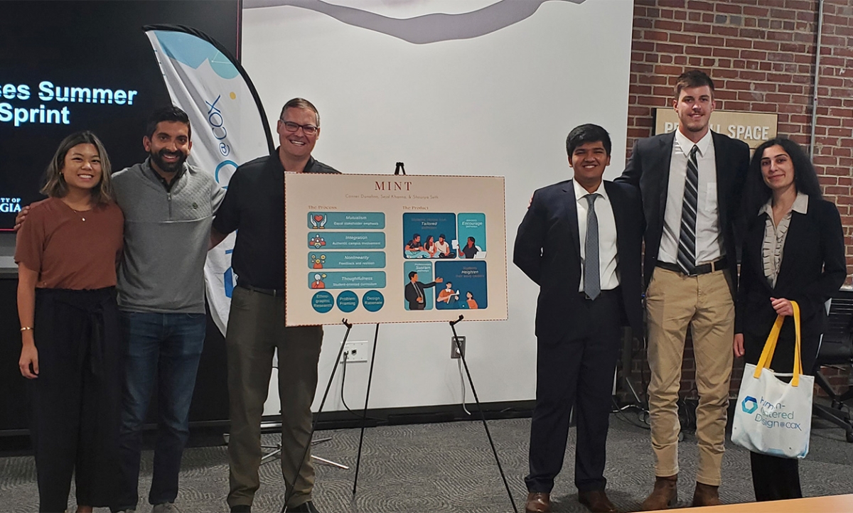 Cox Enterprises executives congratulate Design Sprint winners