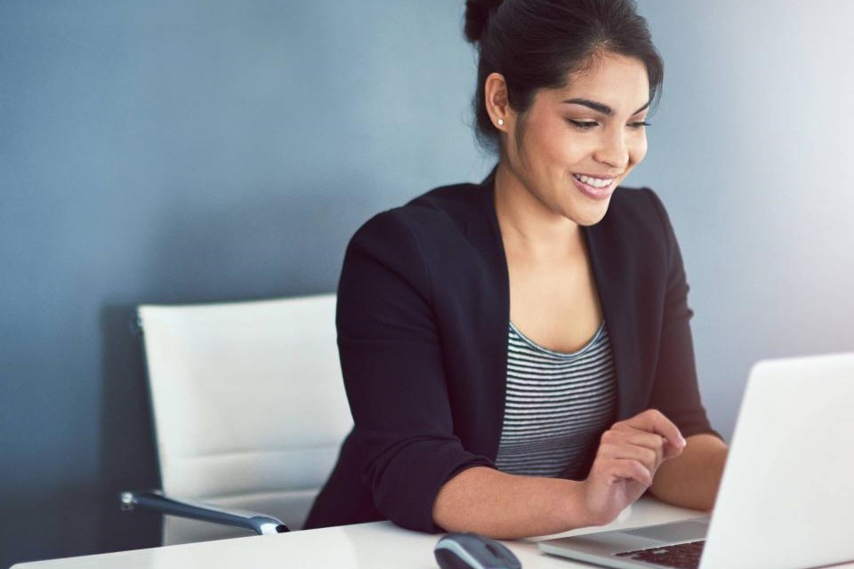 Professional women working at laptop