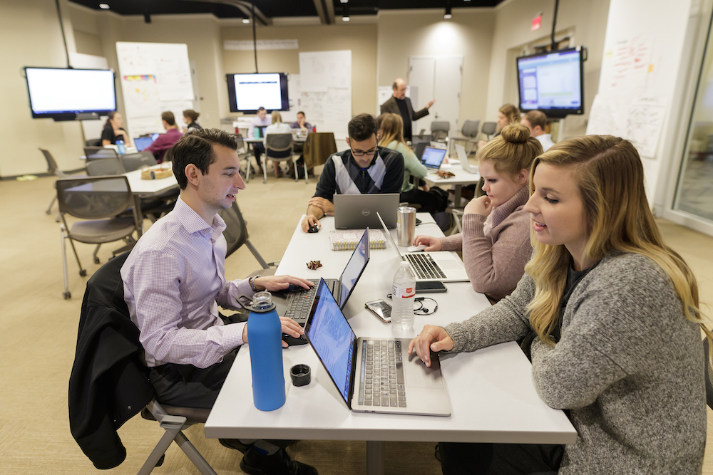 Terry College Full-Time MBA students work together on an assignment during a class.