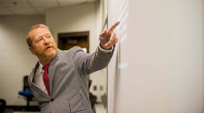 Terry College Music Business Program faculty member David Lowery instructs students during a lecture.