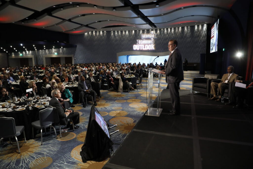 Terry College Dean Benjamin C. Ayers speaks to a large audience during the 36th annual Georgia Economic Outlook in Atlanta.