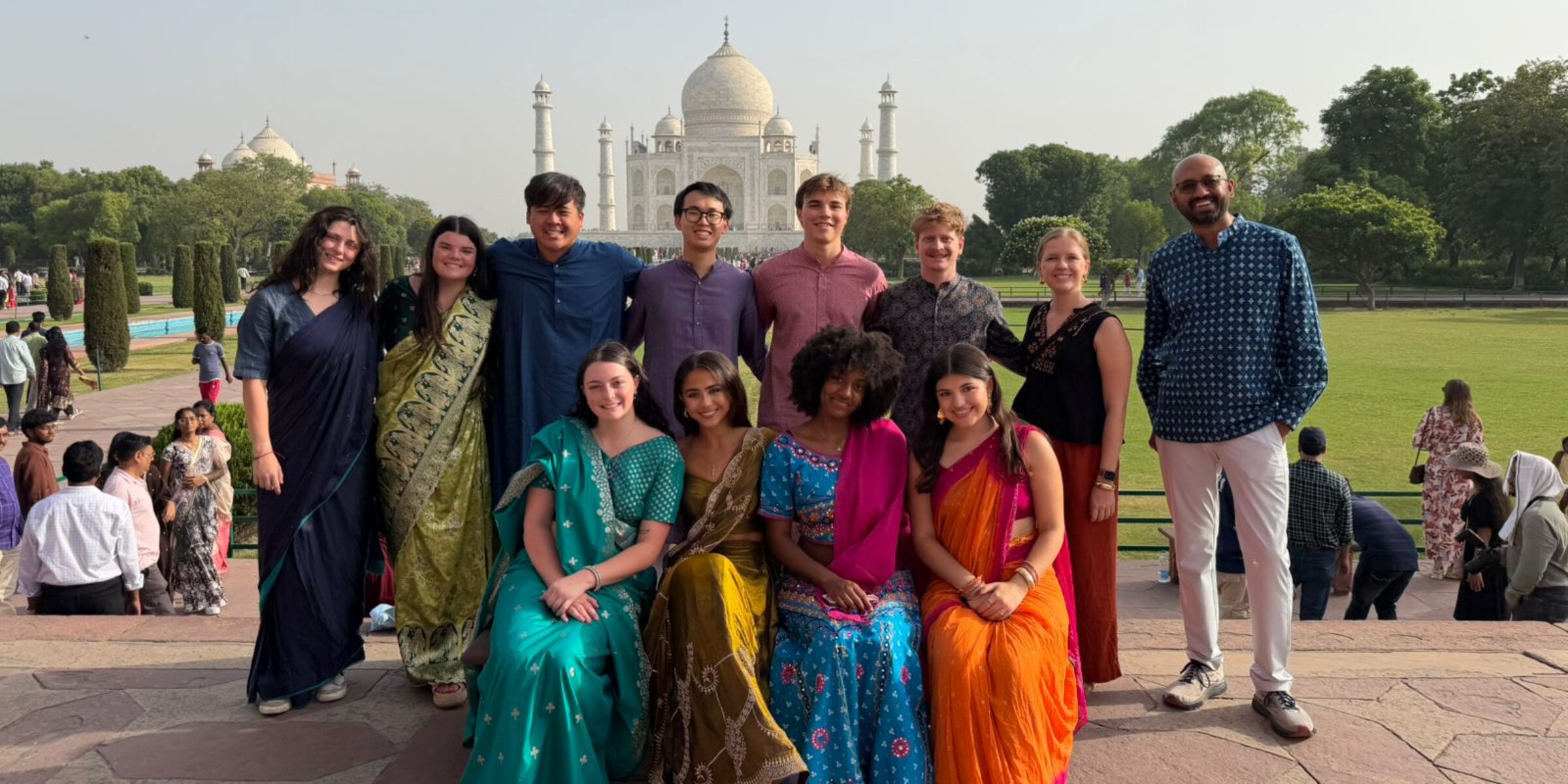 Terry students dressed in saris and kurta pajama in front of the Taj Mahal Study Abroad in India