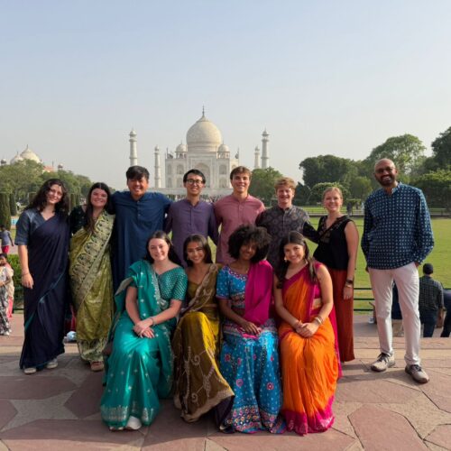 Terry students dressed in saris and kurta pajama in front of the Taj Mahal Study Abroad in India